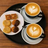 Two Lebanese lattes with biscuits